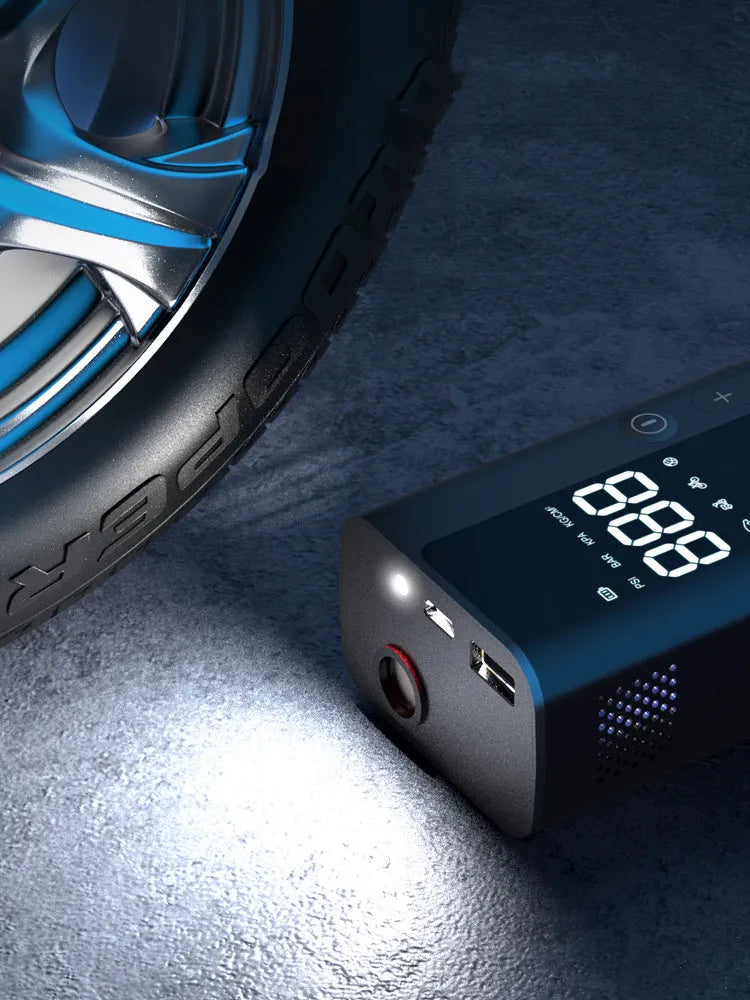 Portable wireless digital air pump on a car tyre with LED light and USB cable