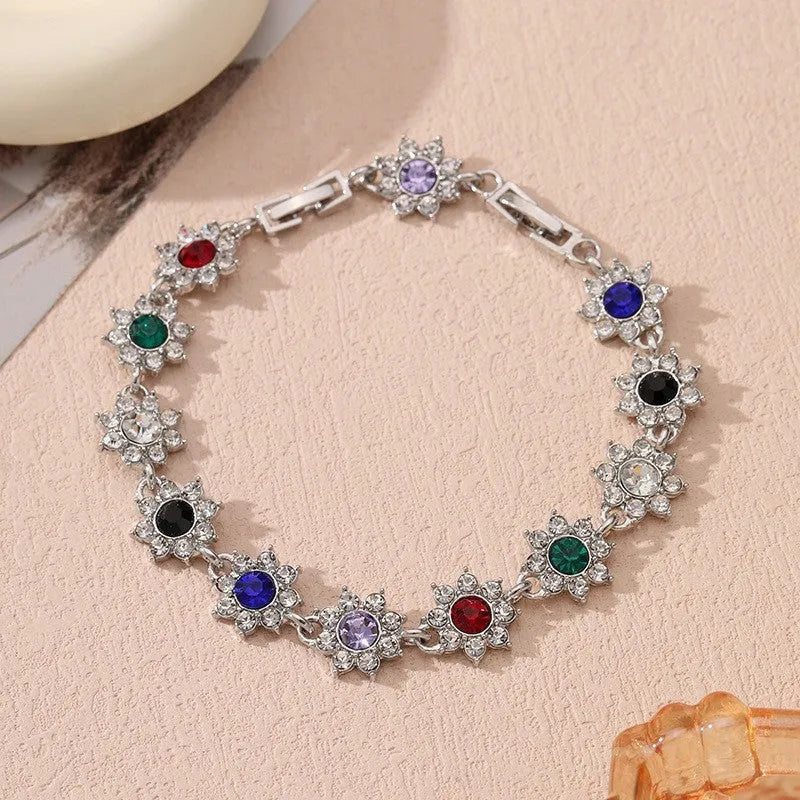 Luxury style bracelet with coloured gems and floral design on zinc alloy with electroplated finish