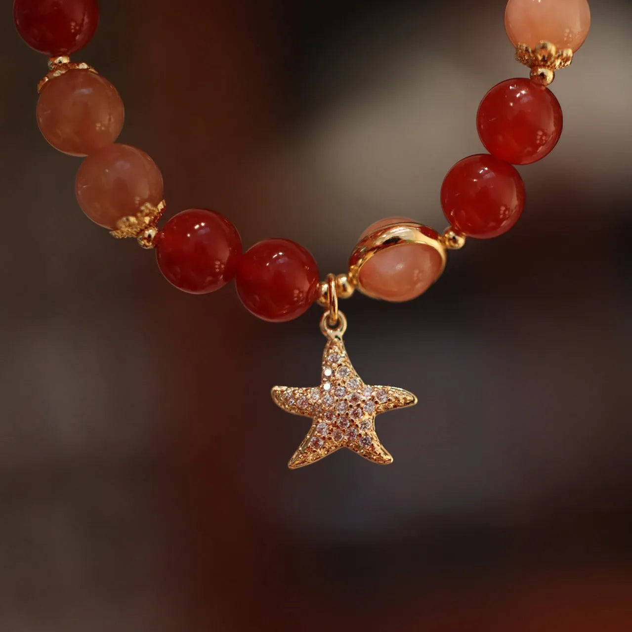 Handmade red agate and Sunstone bracelet with 8mm beads, star design, and ethnic Xiangyun patterning