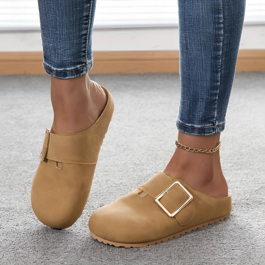 Women's brown closed toe low top canvas slipper shown from the side