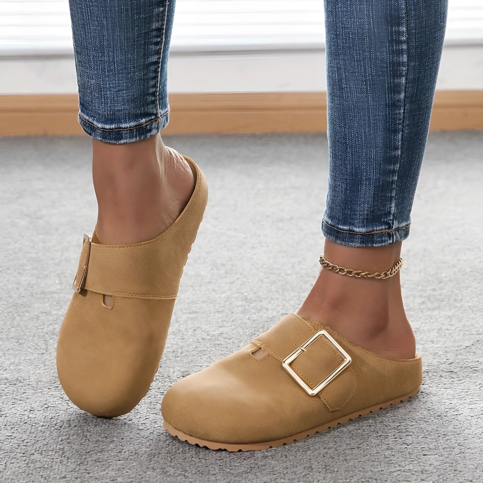Women's brown closed toe low top canvas slipper shown from the side