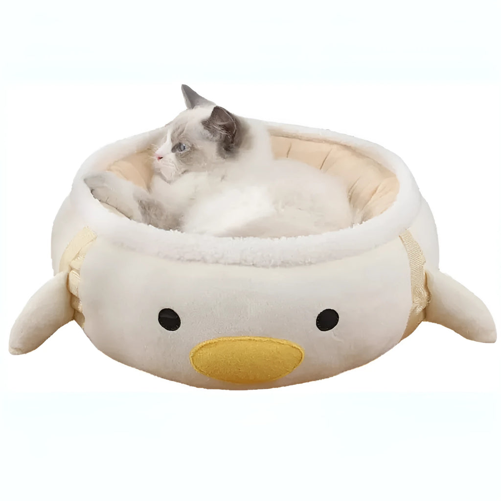 Green chick and dinosaur shaped plush cat bed shown both lying flat and hanging as a hammock.
