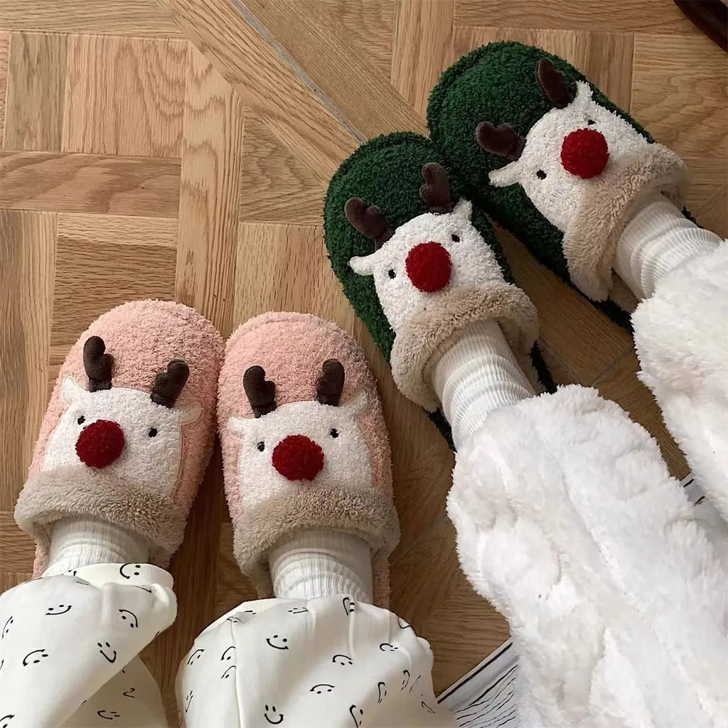 Women's Christmas elk plush slippers with decorative antlers and non-slip PVC soles in brown, green, and pink colours