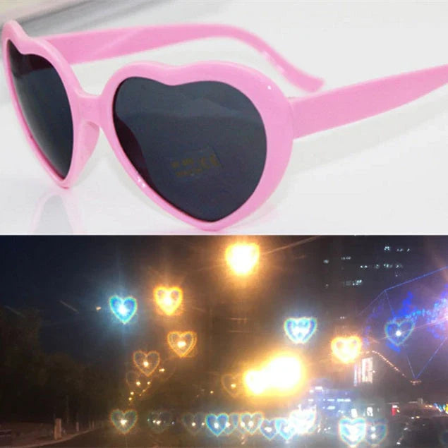 Heart-shaped glow-in-the-dark sunglasses in various vibrant colors, featuring a durable plastic frame and resin lenses for reliable UV protection.