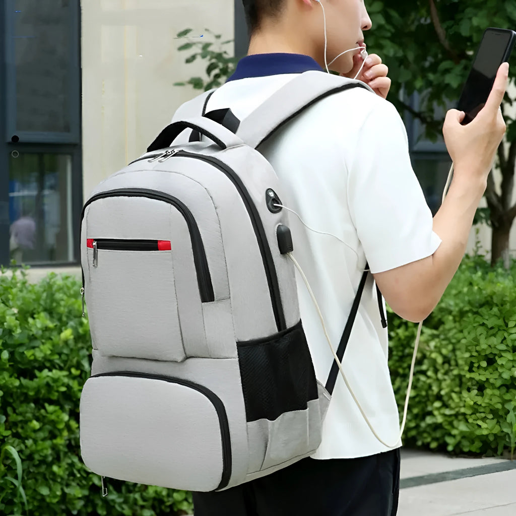 Light grey insulated Oxford cloth backpack with curved shoulder straps and a pull rod belt accessory