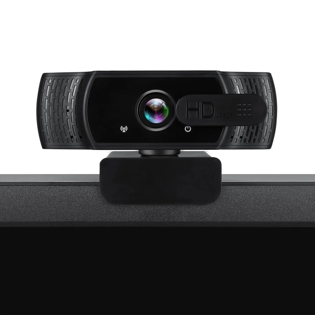 Black USB computer webcam with built-in microphone mounted on a laptop screen.