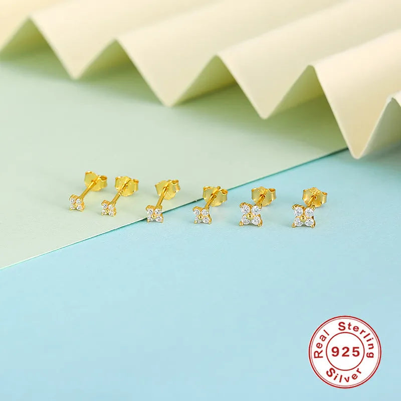 S925 sterling silver stud earrings with a geometric flower and crystal design in gold or platinum finish.