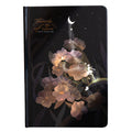 A5 notebook with a luminous cover open to show pages with colour illustrations.