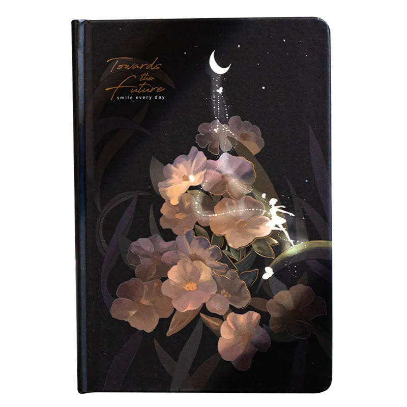A5 notebook with a luminous cover open to show pages with colour illustrations.
