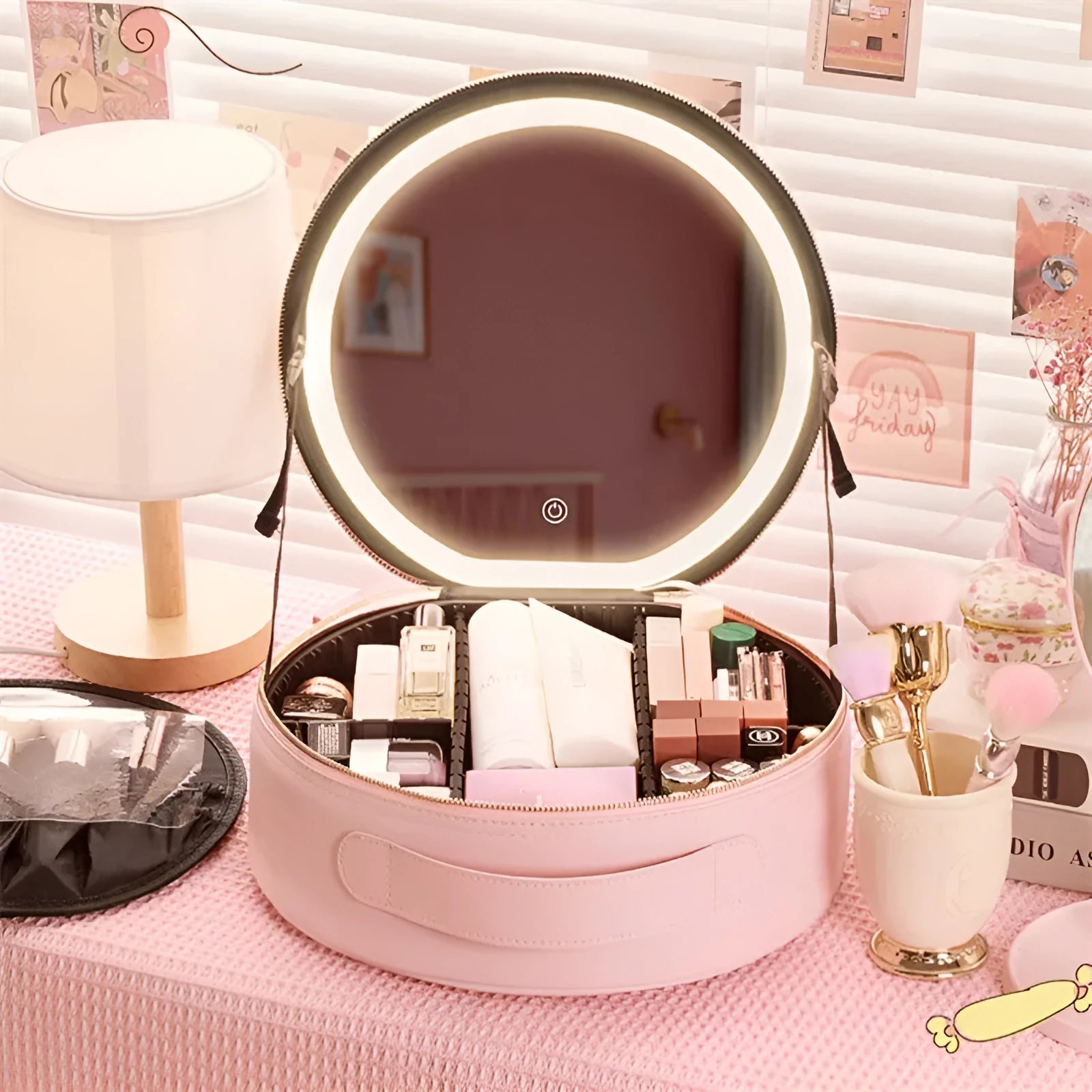 Round pink PU leather LED makeup bag open showing internal mirror, lights, and lattice partitions.