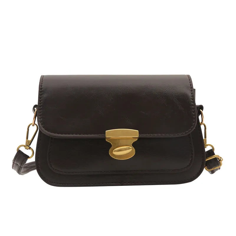 Retro small square handbag in soft brown PU leather with horizontal orientation