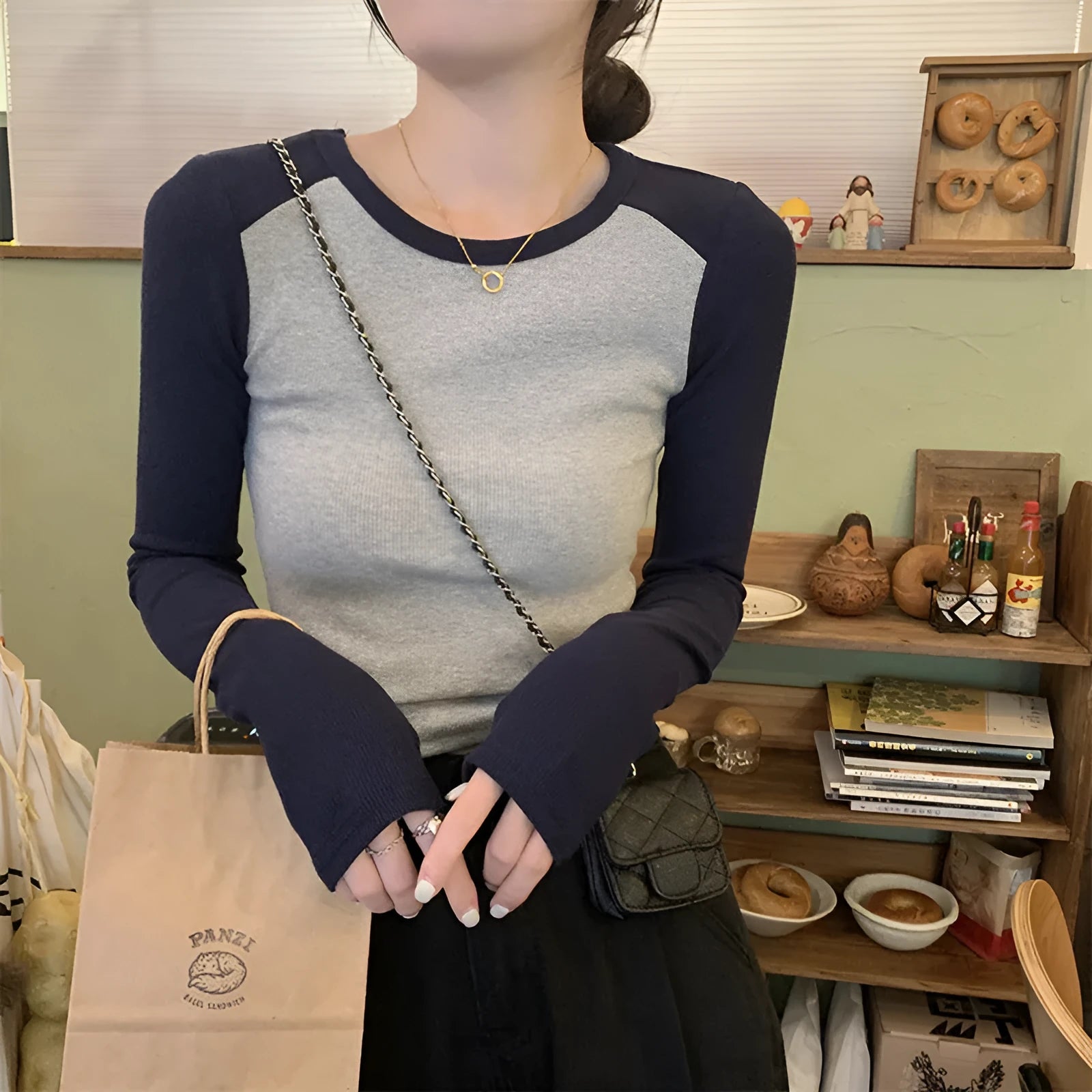 Women's oversized dark blue viscose top with embroidery on the front and long princess sleeves.