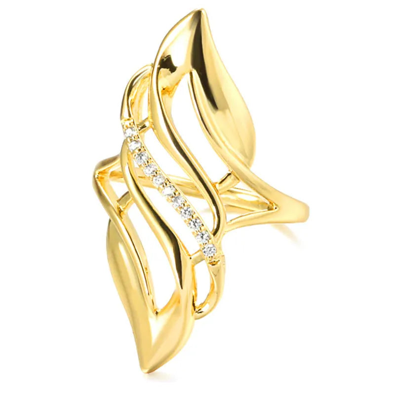 Gold coloured women's ring with exaggerated curved design on copper band