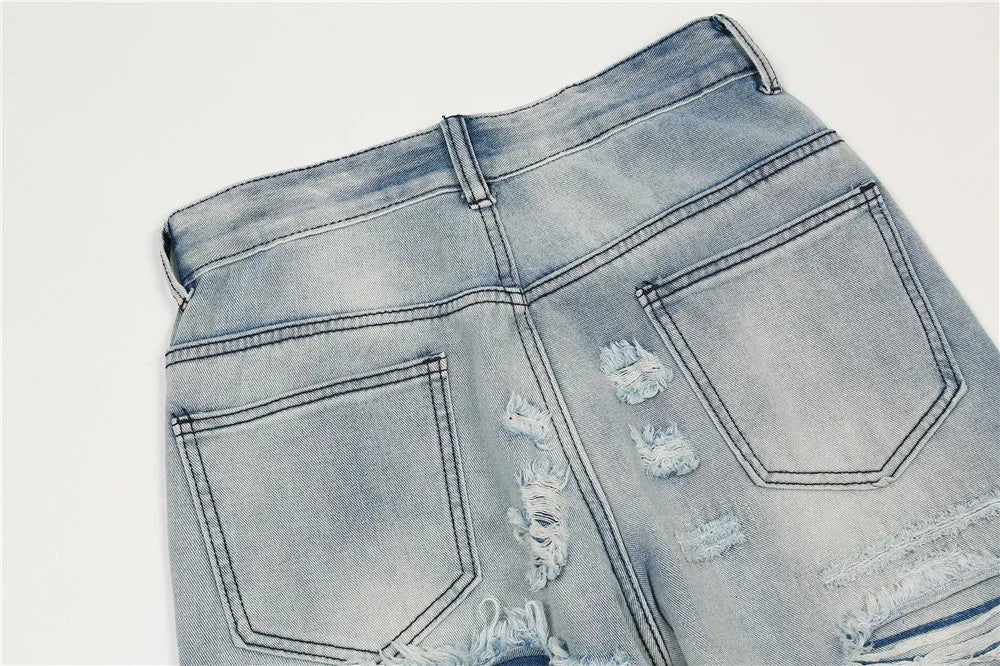 Men's flared washed jeans in light blue denim with zipper fly