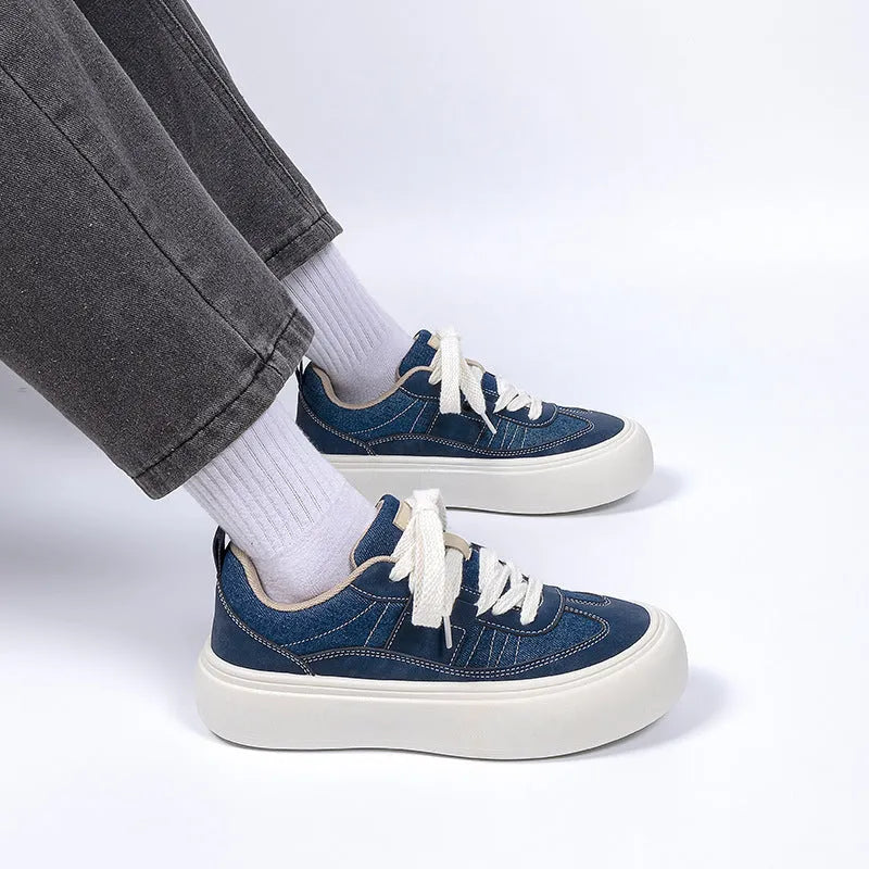 Men's black canvas platform lace-up shoes with a round toe and low-top design on a white background.