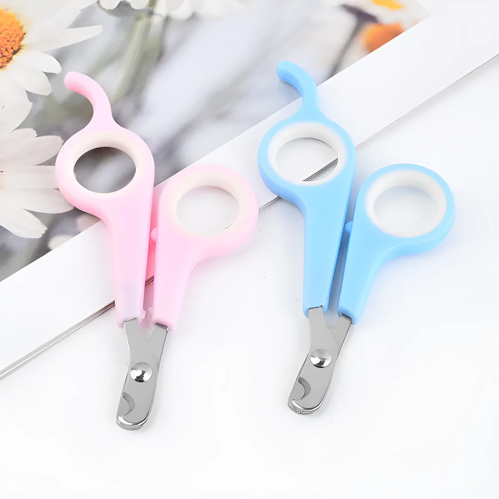 Mini plastic pet nail clippers in blue white and pink white colours on OPP packaging