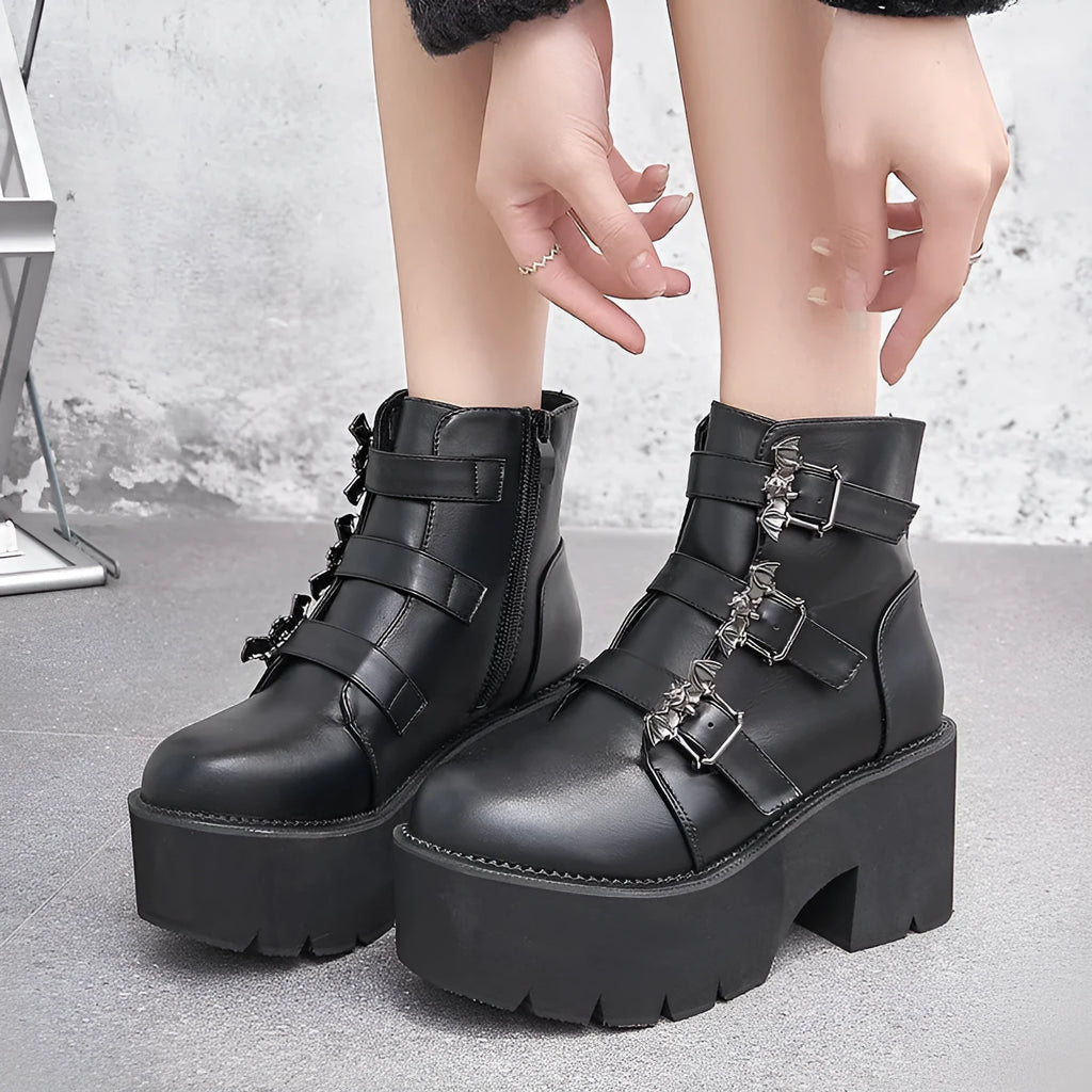 Black women's punk gothic ankle boots with bat buckle, side zip, and thick heel.