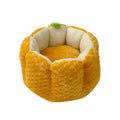 Pumpkin-shaped cat bed with raised rim showing interior cotton filling