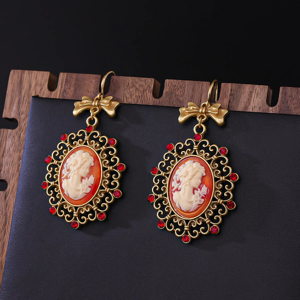 Retro court beauty head earrings in alloy with bow detail and electroplated finish, Beauty Head Ear Drops colour.