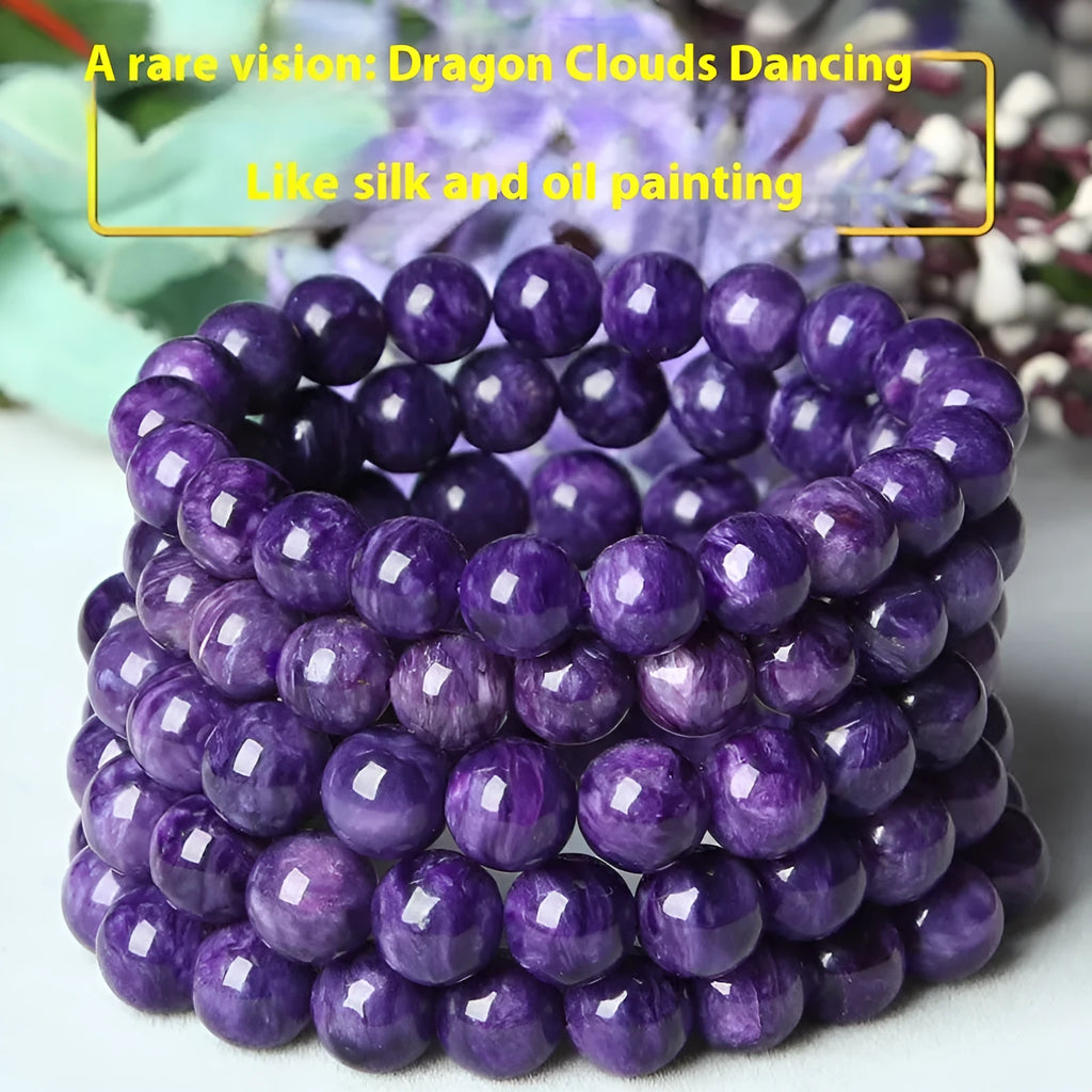 Transparent charoite crystal bracelet with platinum settings on a wrist, showing different bead size options.