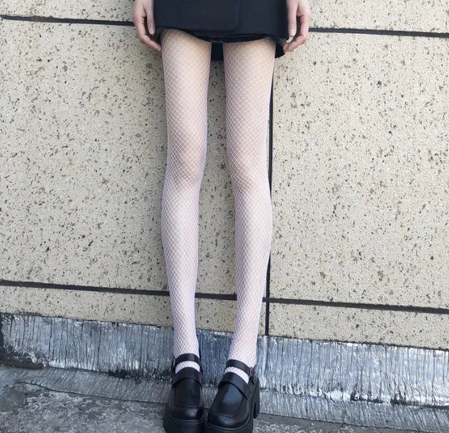 Women's black and white mesh stockings showing large, medium, and small net patterns.