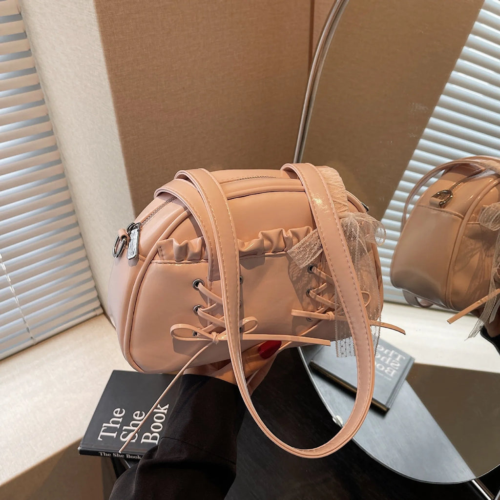 Women's casual PU shoulder handbag with a large bandage bow detail and phone compartment.