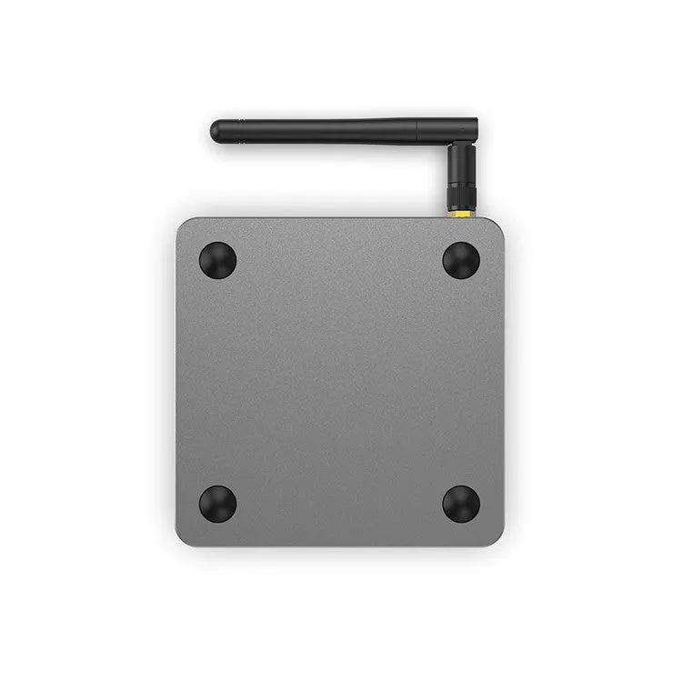 Android smart set-top box with remote control, HDMI cable, and power adapter on a table
