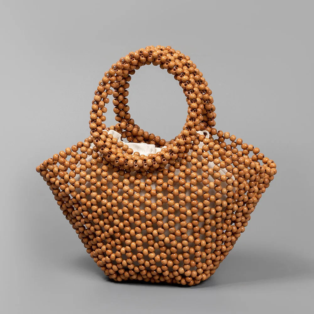 Hand-woven wooden bead beach handbag dumpling shape turmeric colour 13x7x18cm