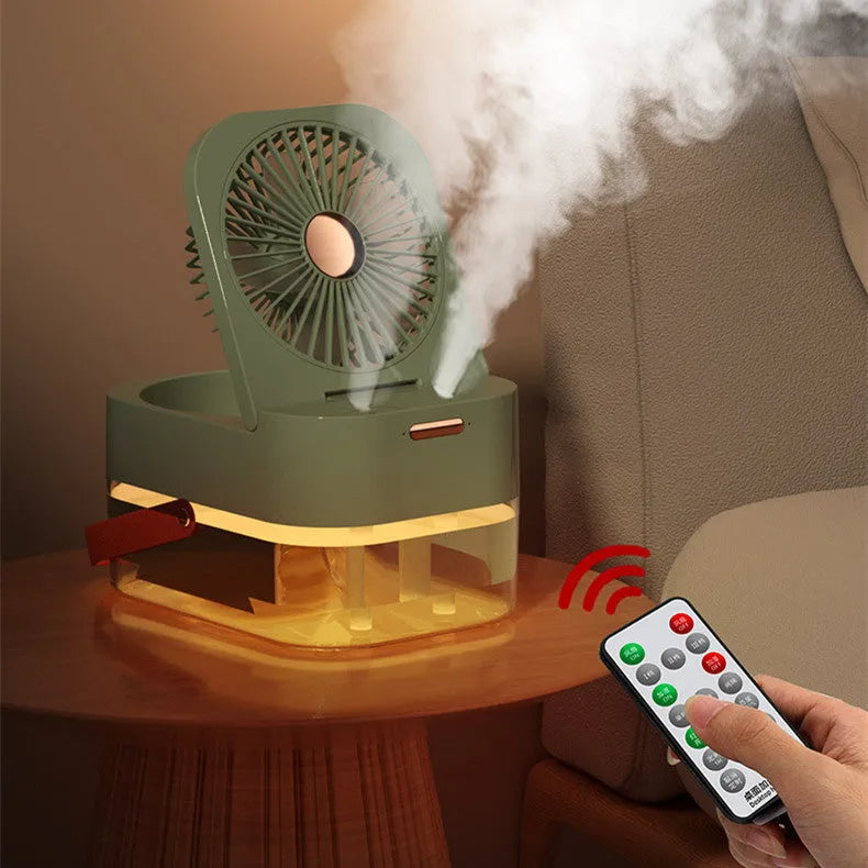 Pearl white USB desktop humidifier mist fan with water tank, remote control, and night light on a wooden desk.