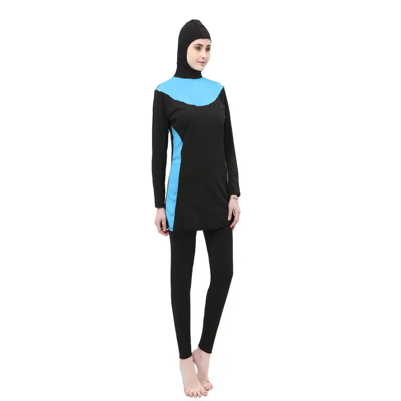Conservative long sleeve hooded swimsuit top and pants set for women on a mannequin.