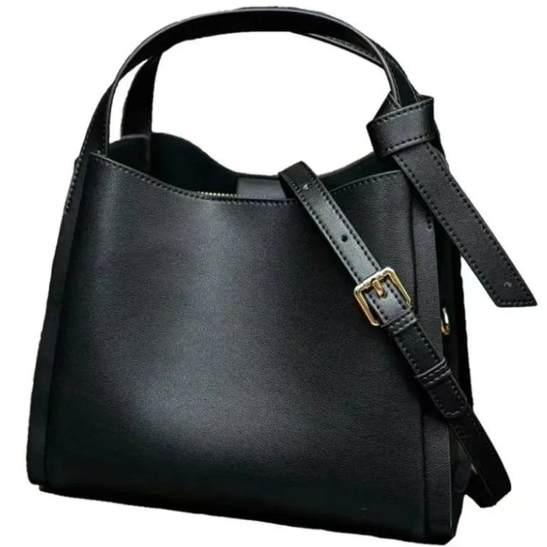 Genuine cowhide leather women's crossbody shoulder bag in bucket shape with interior zipper pockets.