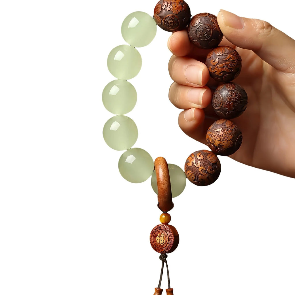 Rosewood bracelet with carved Fu character design in amass fortunes colour, showing 20mm size and flexible ring construction