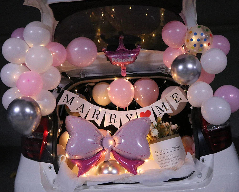 Romantic car trunk proposal decoration kit with balloons, ribbons, and accessories for creating a magical surprise