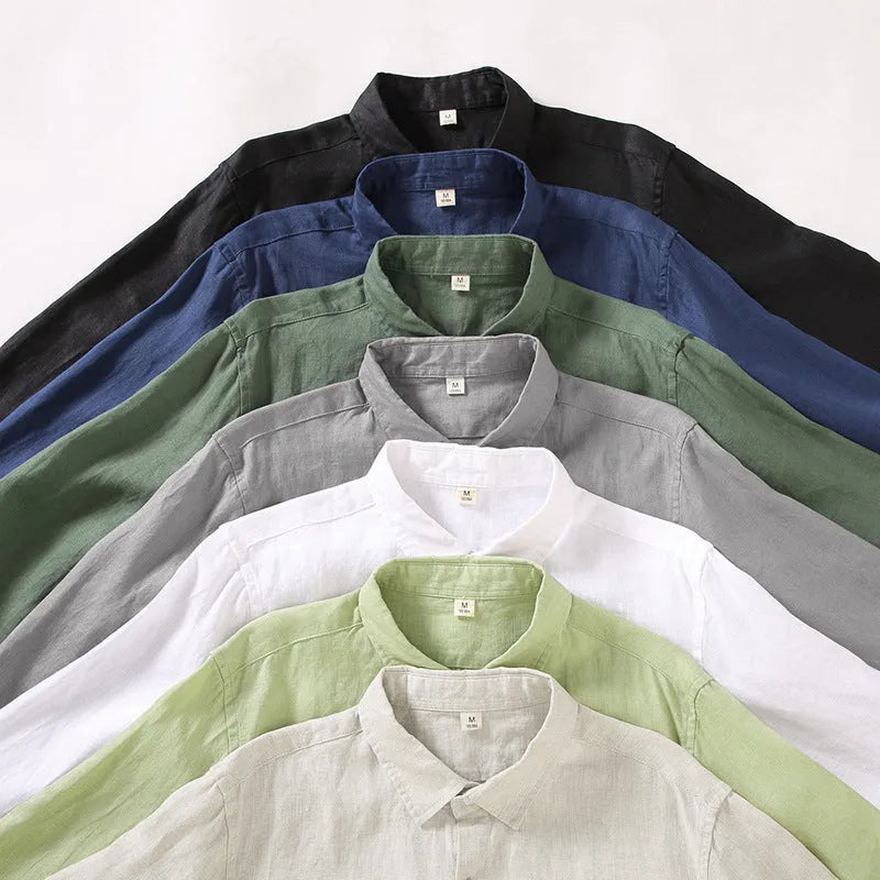 Loose long sleeve linen shirt in a cardigan style on a hanger, shown in light sapphire blue colour.