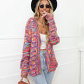 Rose red women's short cardigan with rainbow festival stripes, loose fit, worn open as a coat.