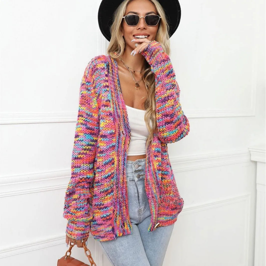 Rose red women's short cardigan with rainbow festival stripes, loose fit, worn open as a coat.