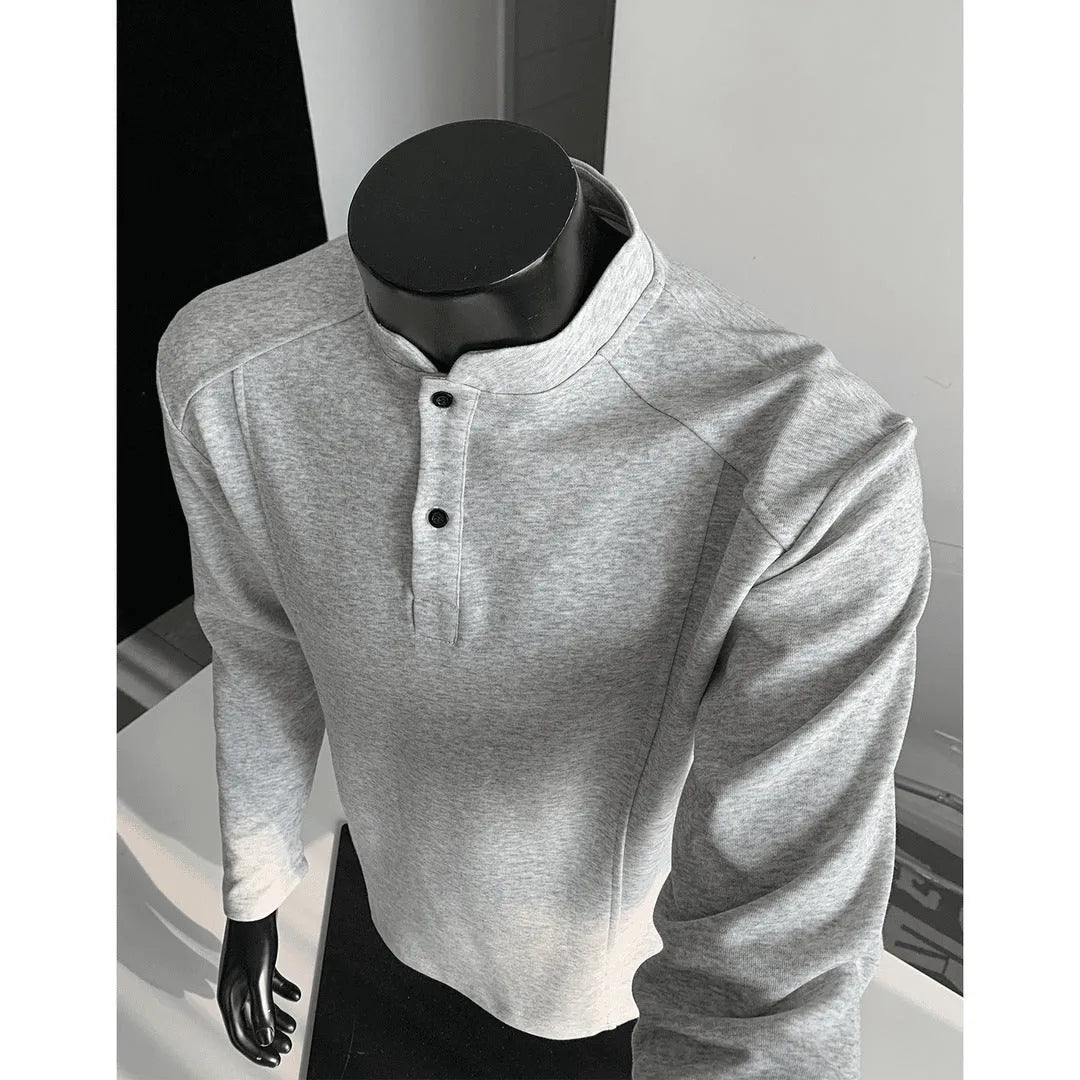 Men's grey polo shirt with patchwork detailing on shoulders and stand-up collar