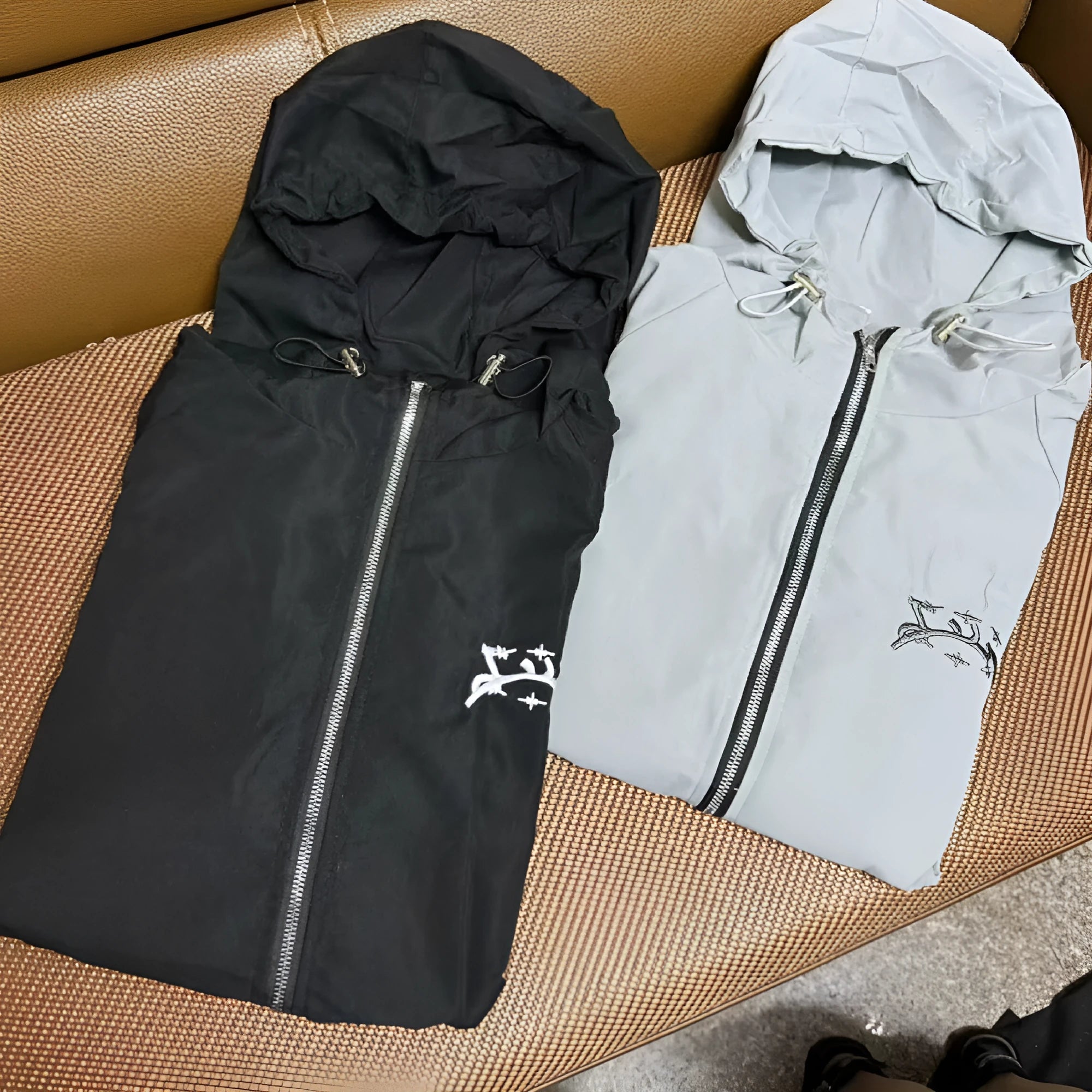 Men's grey hooded sunscreen jacket in British style with loose fit polyester construction