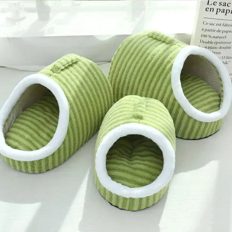 Striped thickened 3D dog bed with removable sponge mattress in blue, shown in a home setting