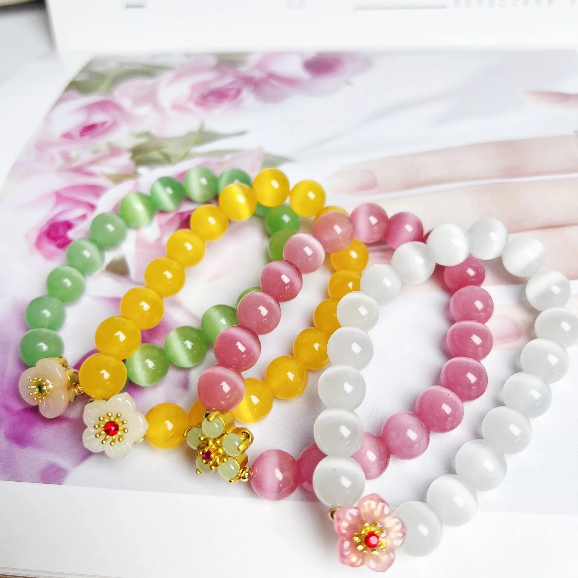 Women's handmade glass bead bracelet with floral design in green, pink, white or yellow