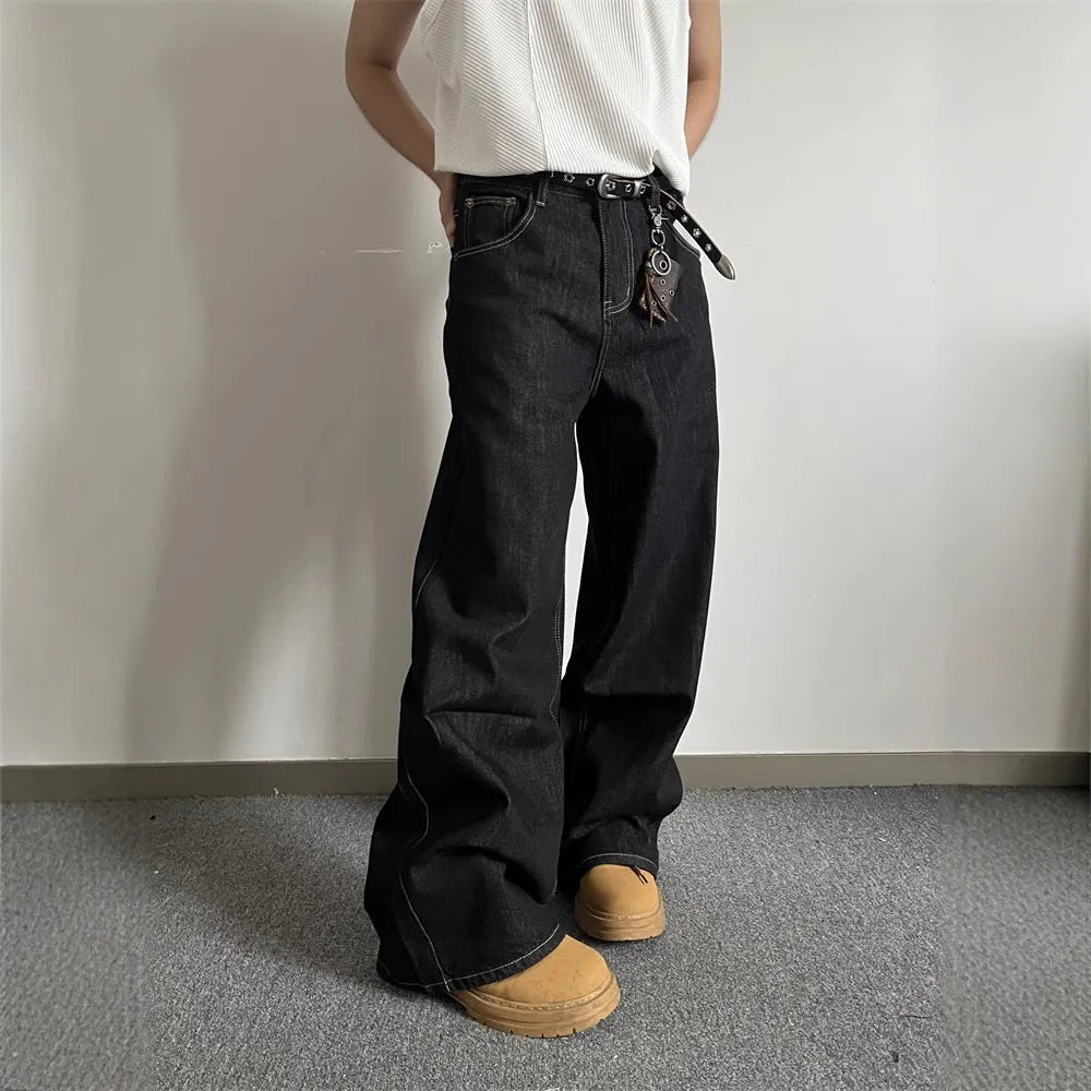 Black retro-style loose-fit straight-leg denim jeans on a hanger.