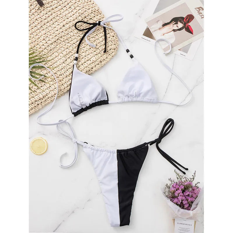 Women's black and white lace-up triangle cup bikini swimsuit set with adjustable ties