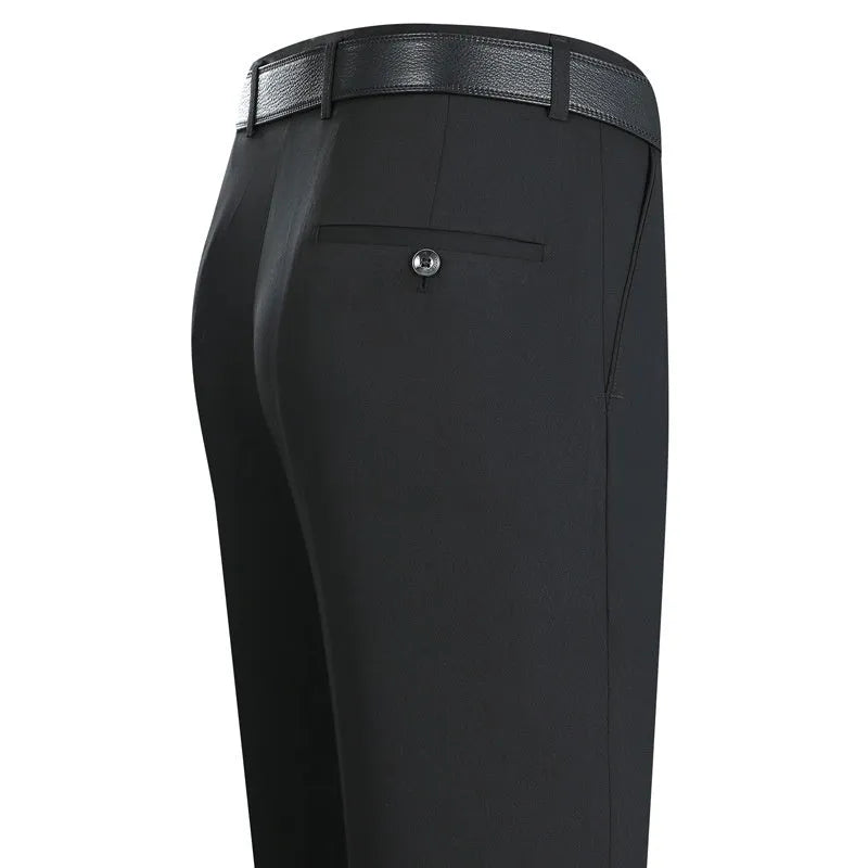 Man wearing dark blue straight-cut high-waist business trousers made from a mulberry silk blend.