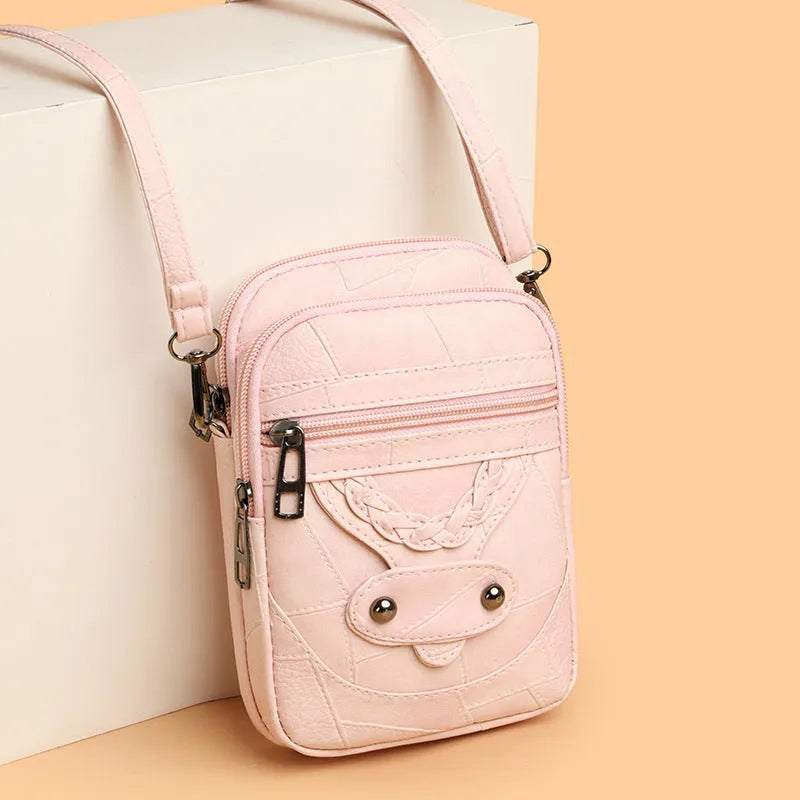 Soft brown PU leather vertical mobile phone bag with weaving pattern and metal rivets.