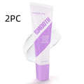 PHOFAY pain-free hair removal cream tube and plastic scraper on a pink background.