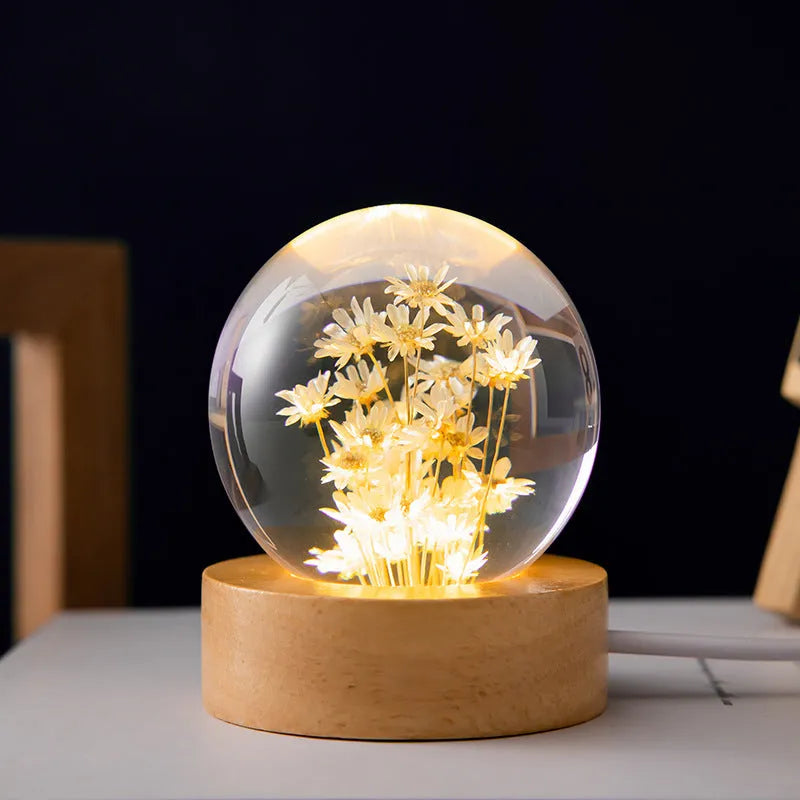 3D dandelion eternal flower night light in resin crystal ball on beech wood stand.