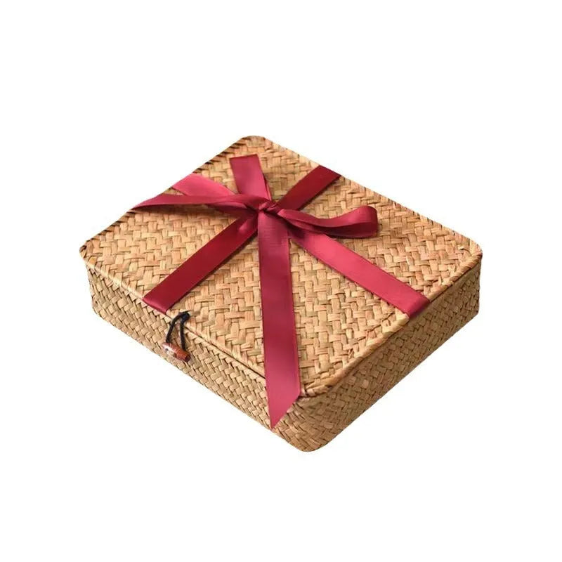 Handwoven natural straw storage box on a wooden desktop, size 32x28x7 cm, in coffee colour