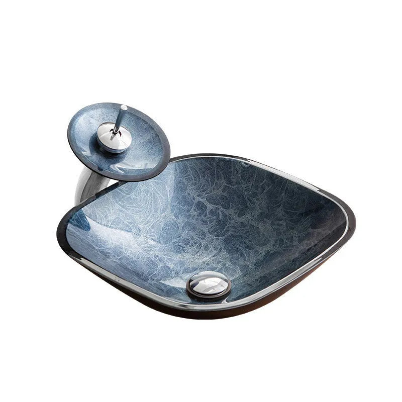 Modern blue-grey tempered glass table basin with a simple design for bathroom vanity units.