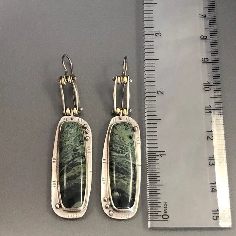Geometric two-colour marble pattern alloy drop earrings showing marbled surface detail