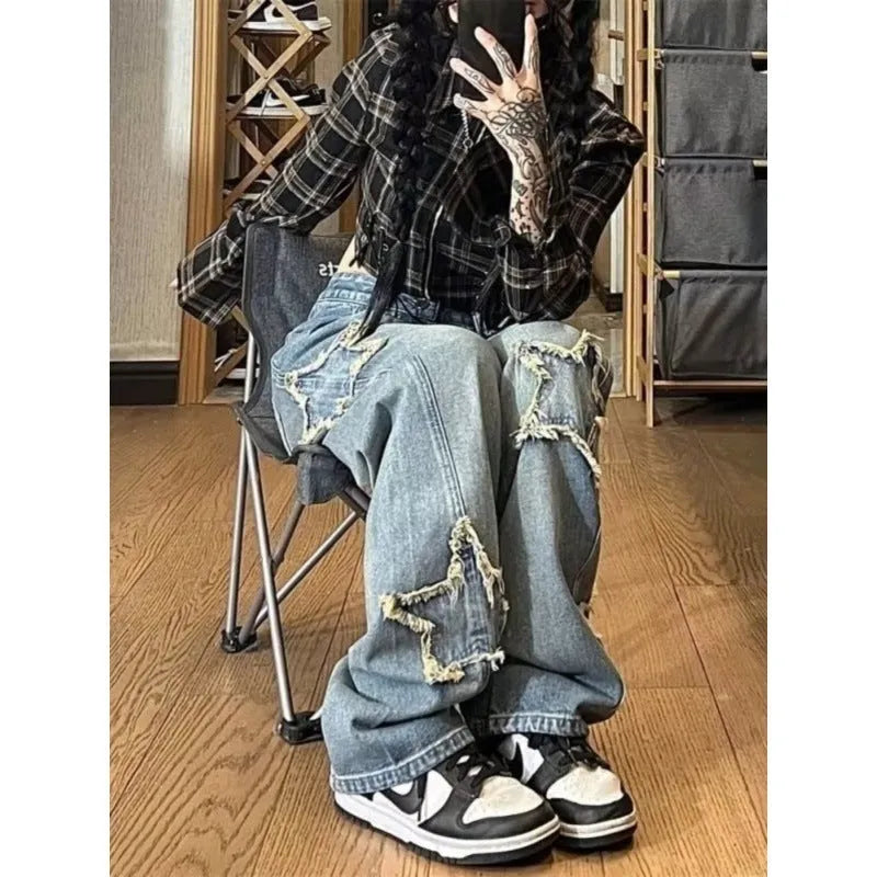 Blue high-waisted wide-leg denim jeans with straight-leg design on hanger